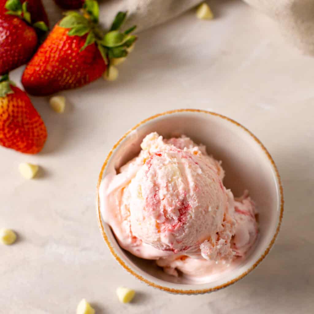 a close up shot of the no churn strawberry ice cream 