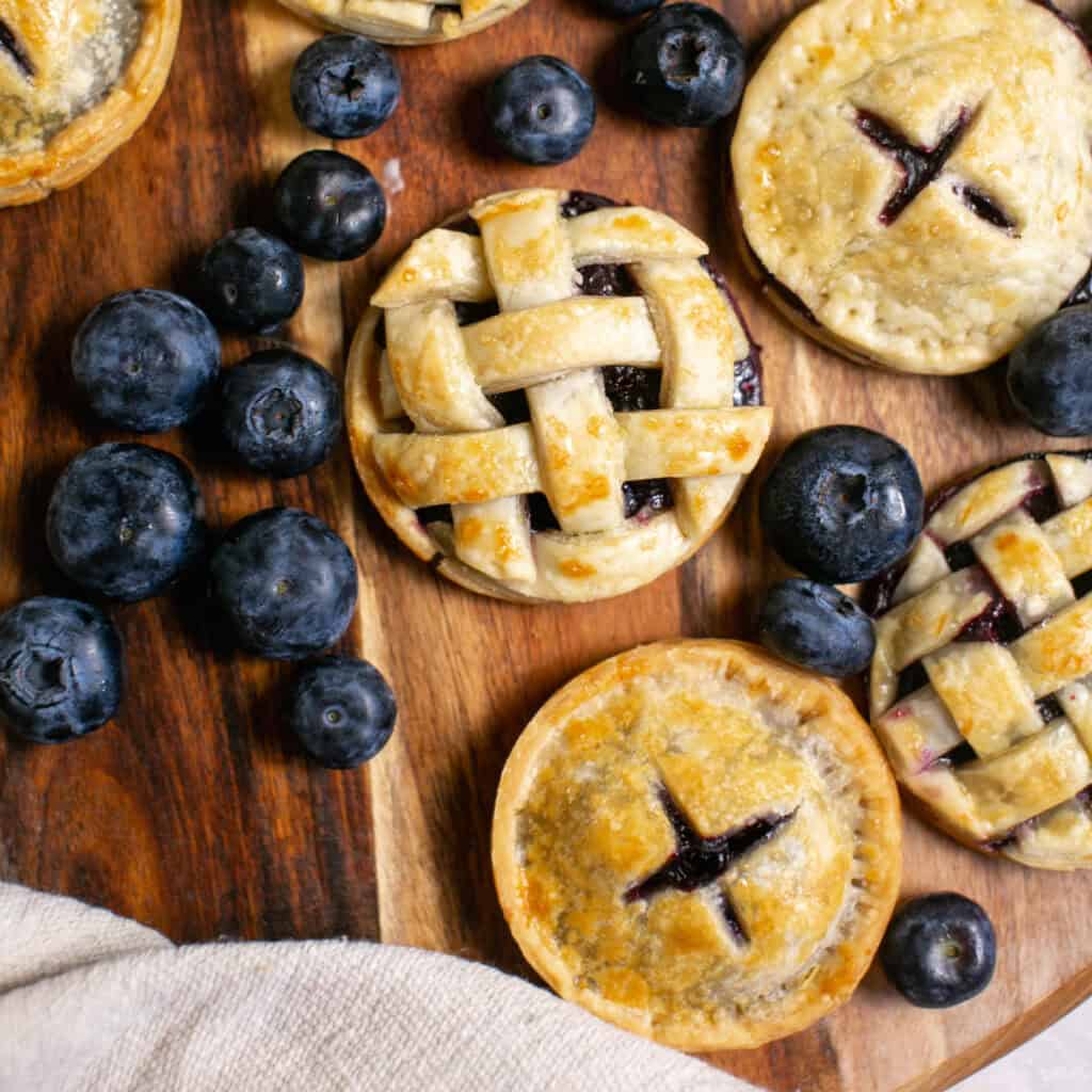 An overhead shot of the blueberry hand pies, showing the lattice topping and then criss cross pattern.