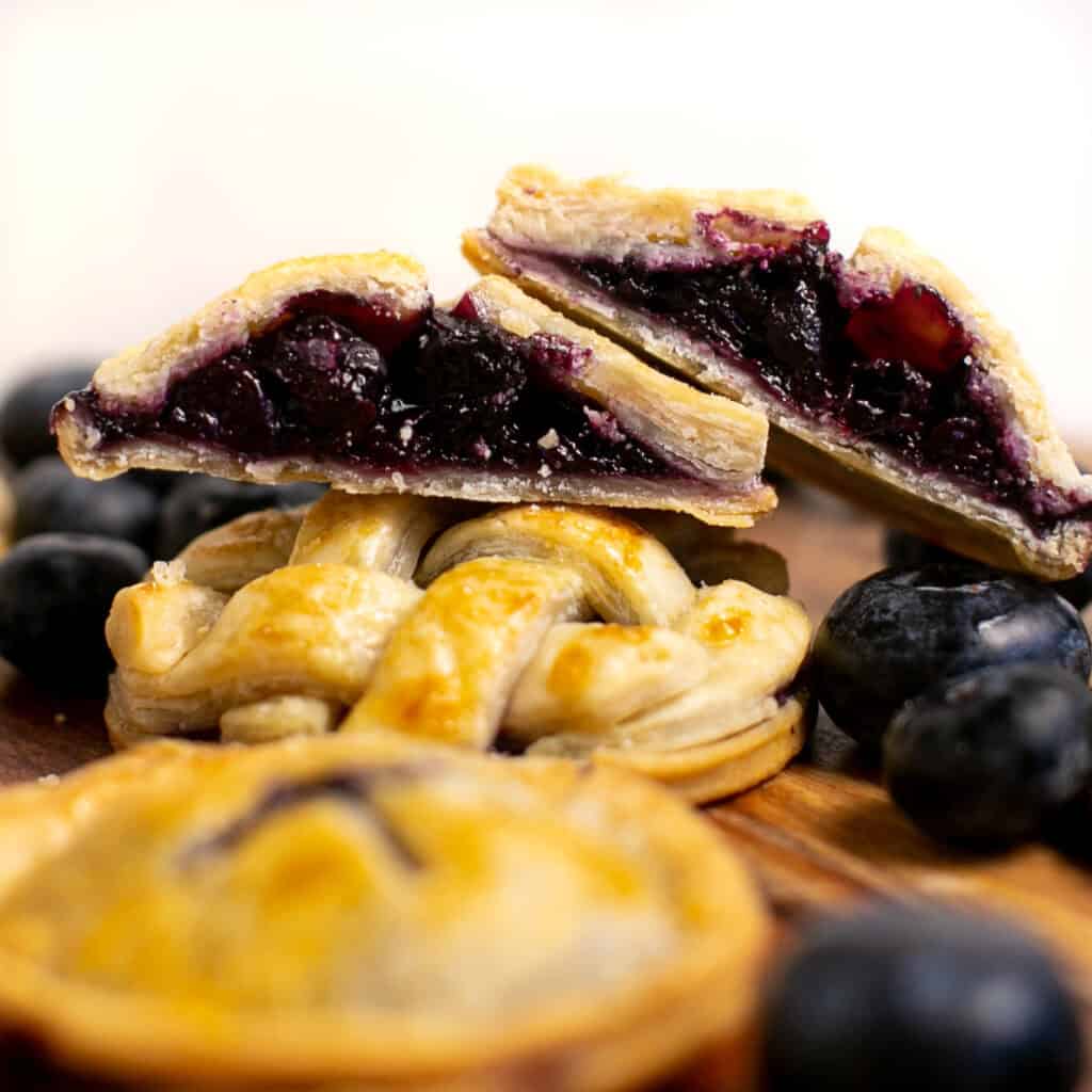 An inside look of the mini blueberry hand pies 