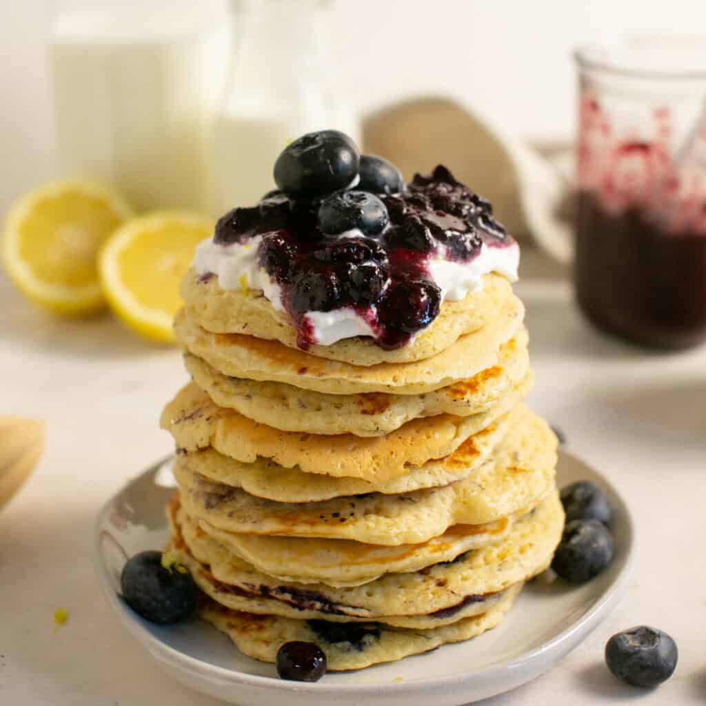 Blueberry compote sliding down the blueberry pancakes