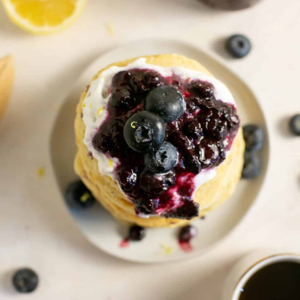 An overhead shot of the blueberry compote on top of the pancakes