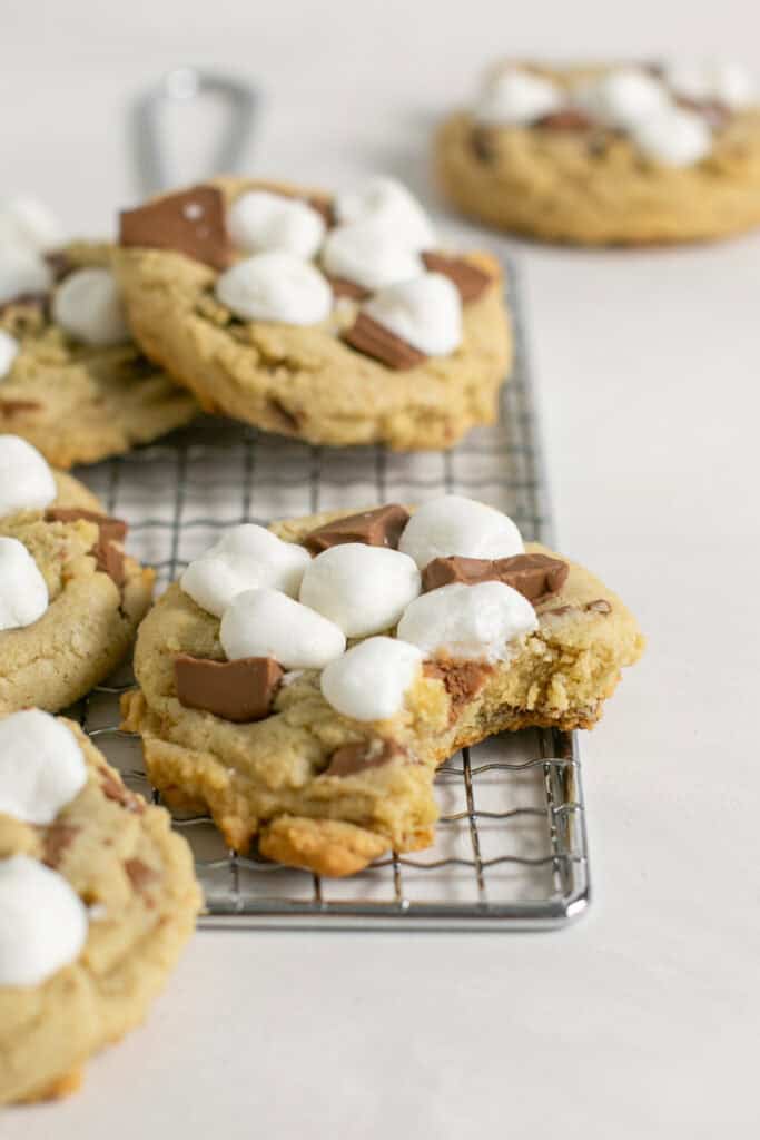 A picture of the s'mores cookies sitting on a cooling rack. 