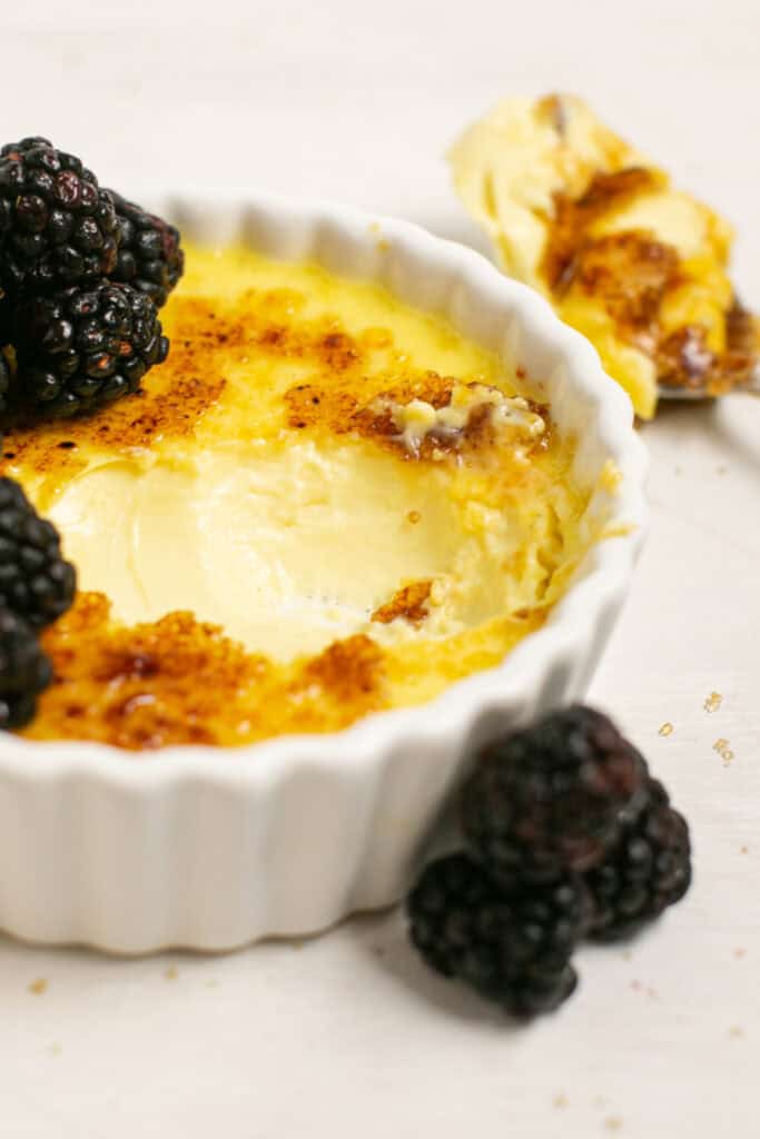 a picture showing the smooth creamy custard of the vanilla bean creme brulee