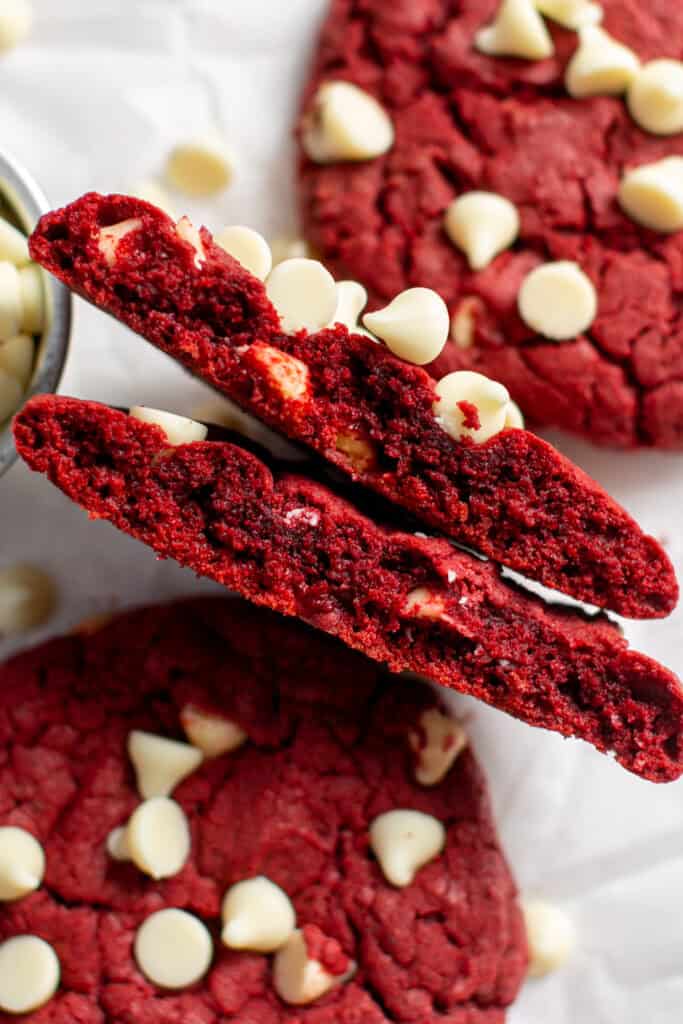 A closer shot of a red velvet cake mix cookie broken in half.