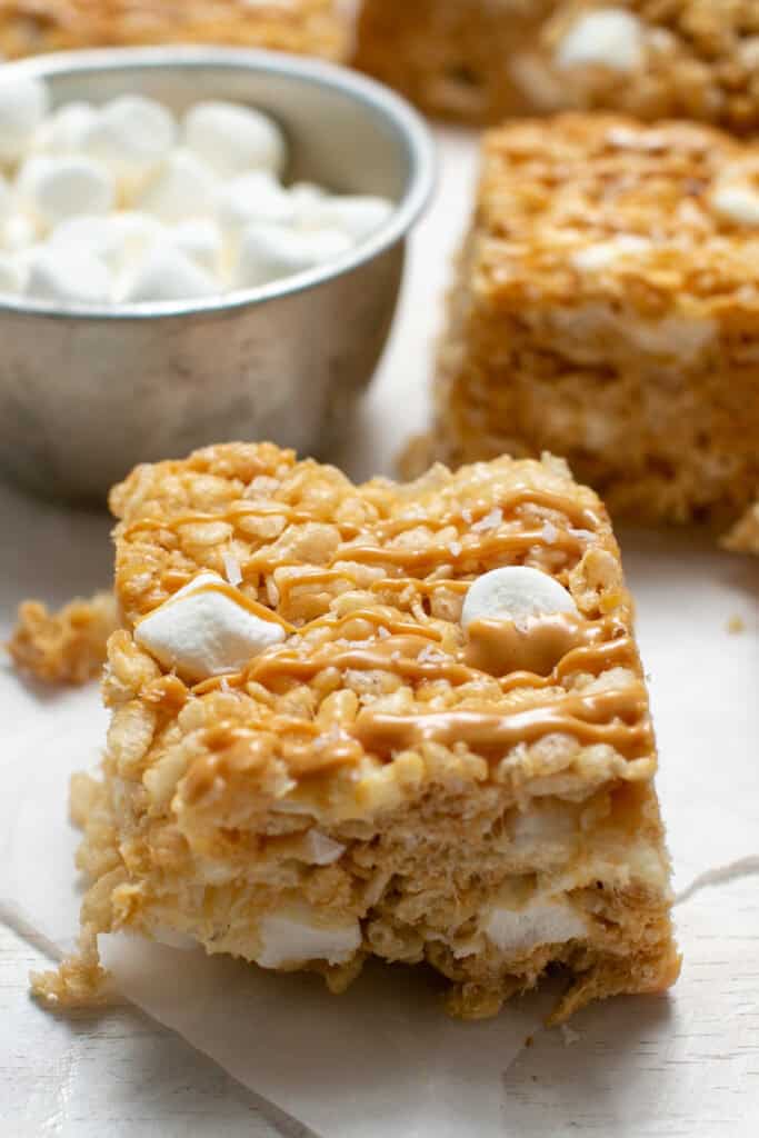 a picture of the peanut butter marshmallow squares showing the sprinkle of salt on top. 