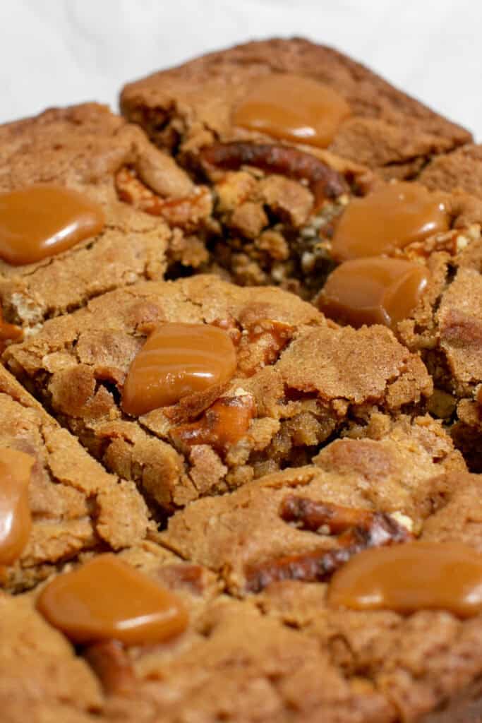 A close up picture showing the melty caramel on the salted caramel pretzel blondies
