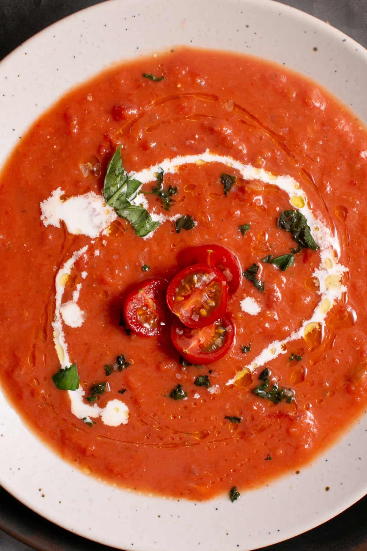 Tomato soup with tomatoes on top 