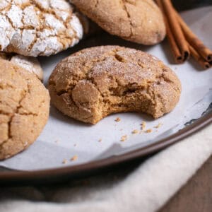Spiced Crinkle Cookies with a bite missing.