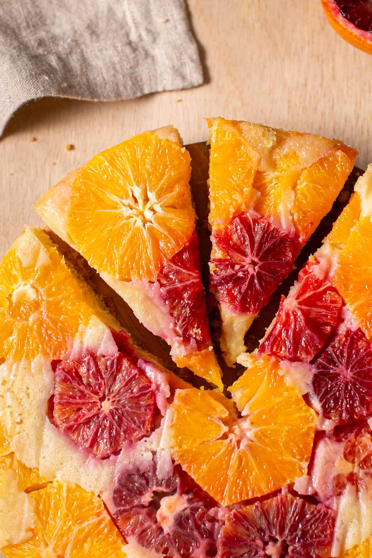 Two slices cut out of a winter citrus cake. 