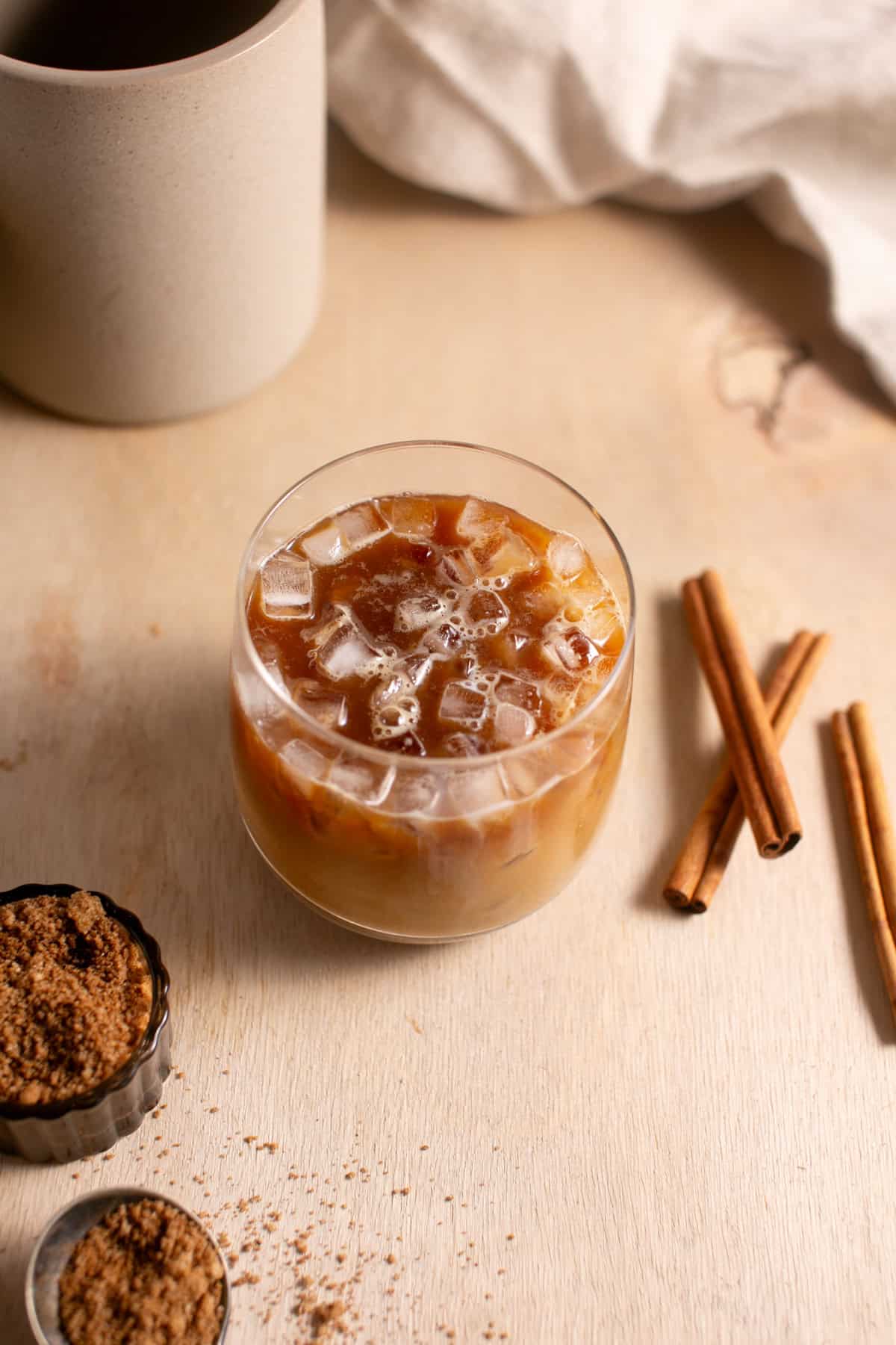 A small glass of an iced dirty chai.