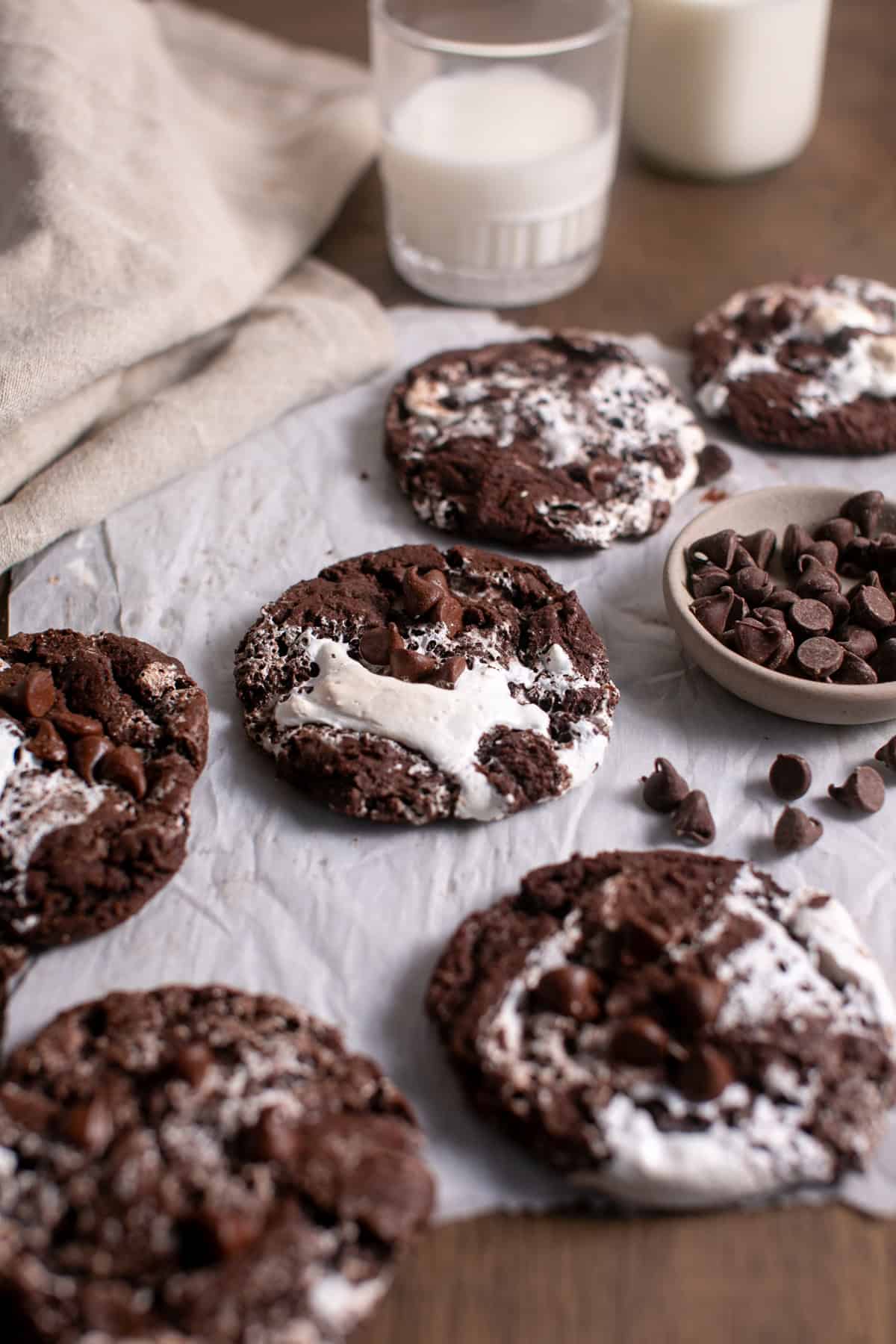 Hot Chocolate cookies sitting by a glass of milk.