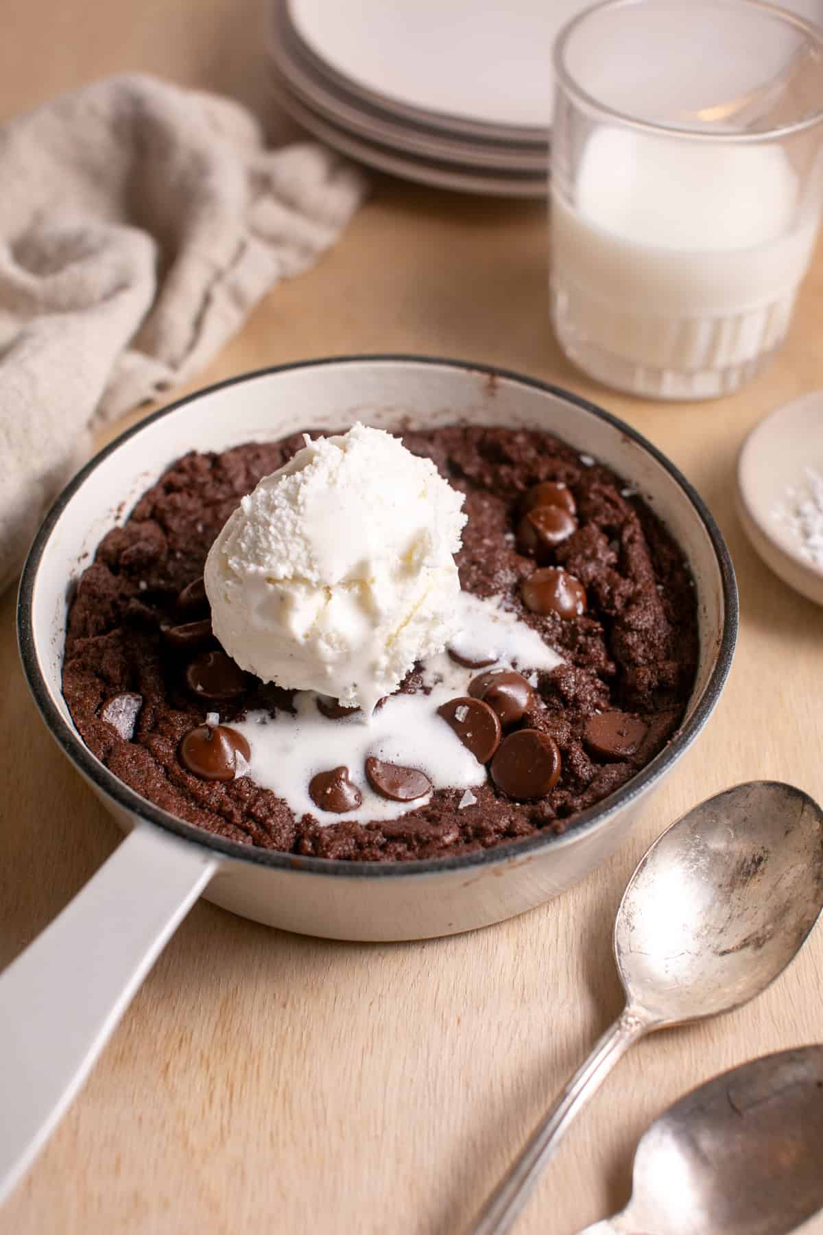 Double Chocolate Skillet Cookie with a scoop of melting ice cream.