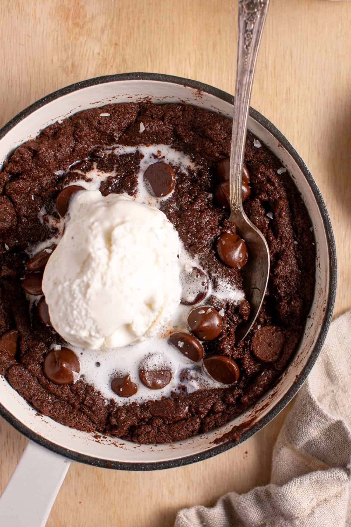 Double Chocolate Skillet Cookie with a spoon scooping in the middle.