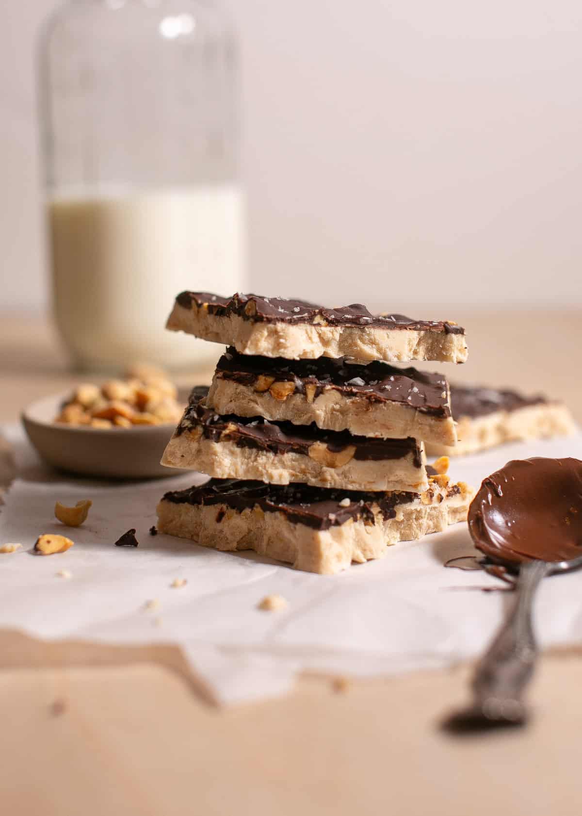 Peanut Butter Yogurt Bark stacked on parchment paper. 