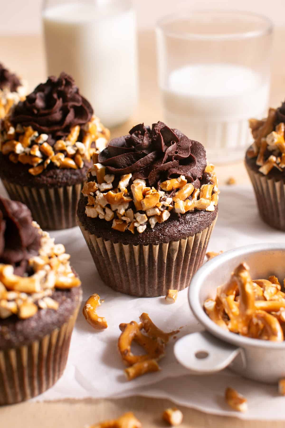 Salted Chocolate Cupcakes by a glass of milk.