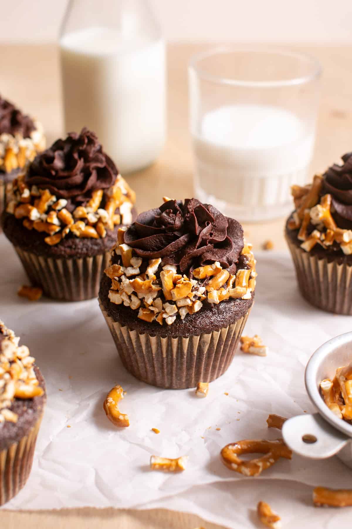 Salted Chocolate Cupcakes on parchment paper. 