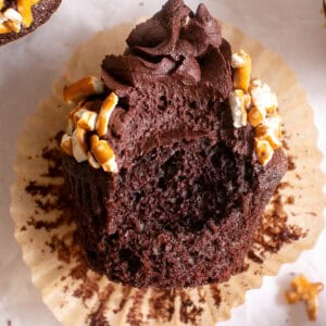 Salted Chocolate Cupcakes with a bite missing.