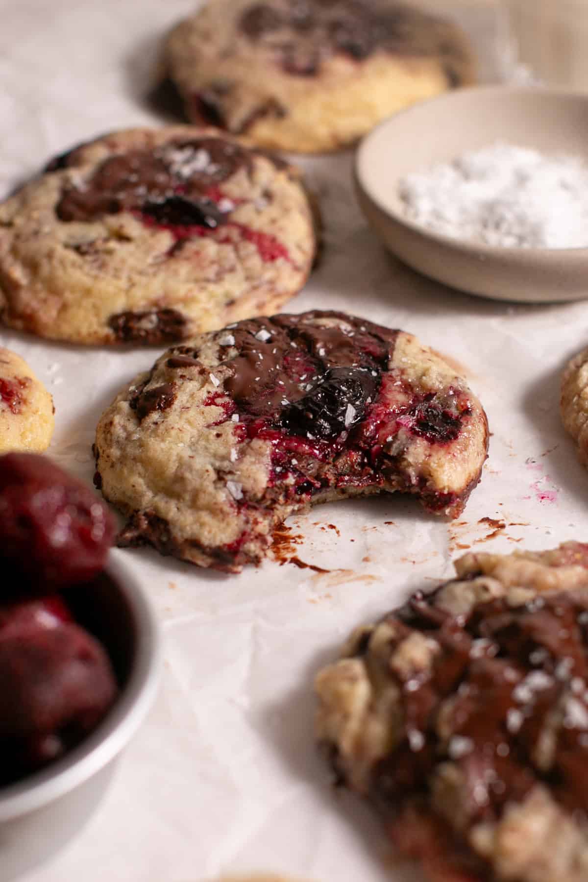 Dark Chocolate Cherry Cookies with a bite taken out. 