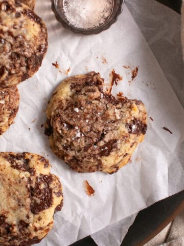 Chocolate Chip Brownie Cookies on parchment paper.