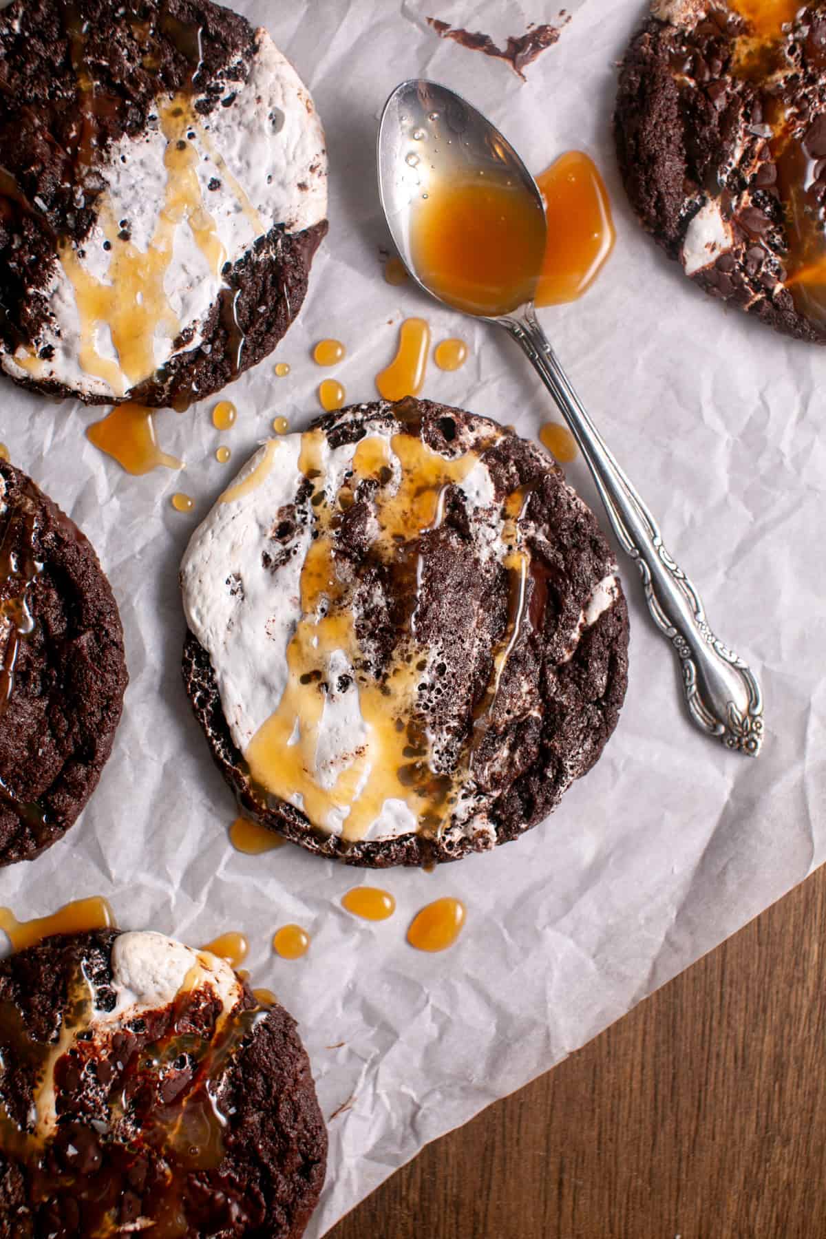 Chocolate Marshmallow Caramel Cookies with a spoon and caramel. 