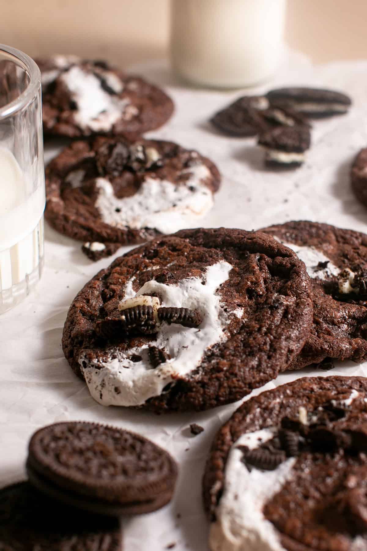 Minty Chocolate Marshmallow Cookies by a glass of milk.