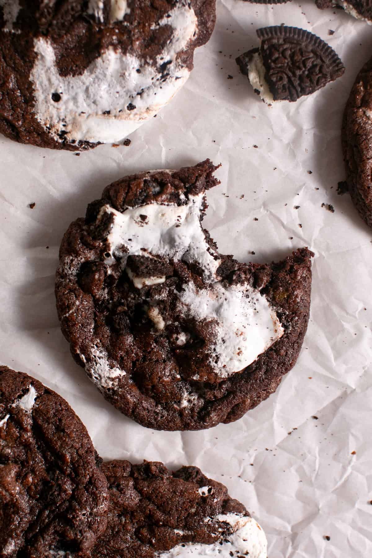 Minty Chocolate Marshmallow Cookies with a bite missing. 