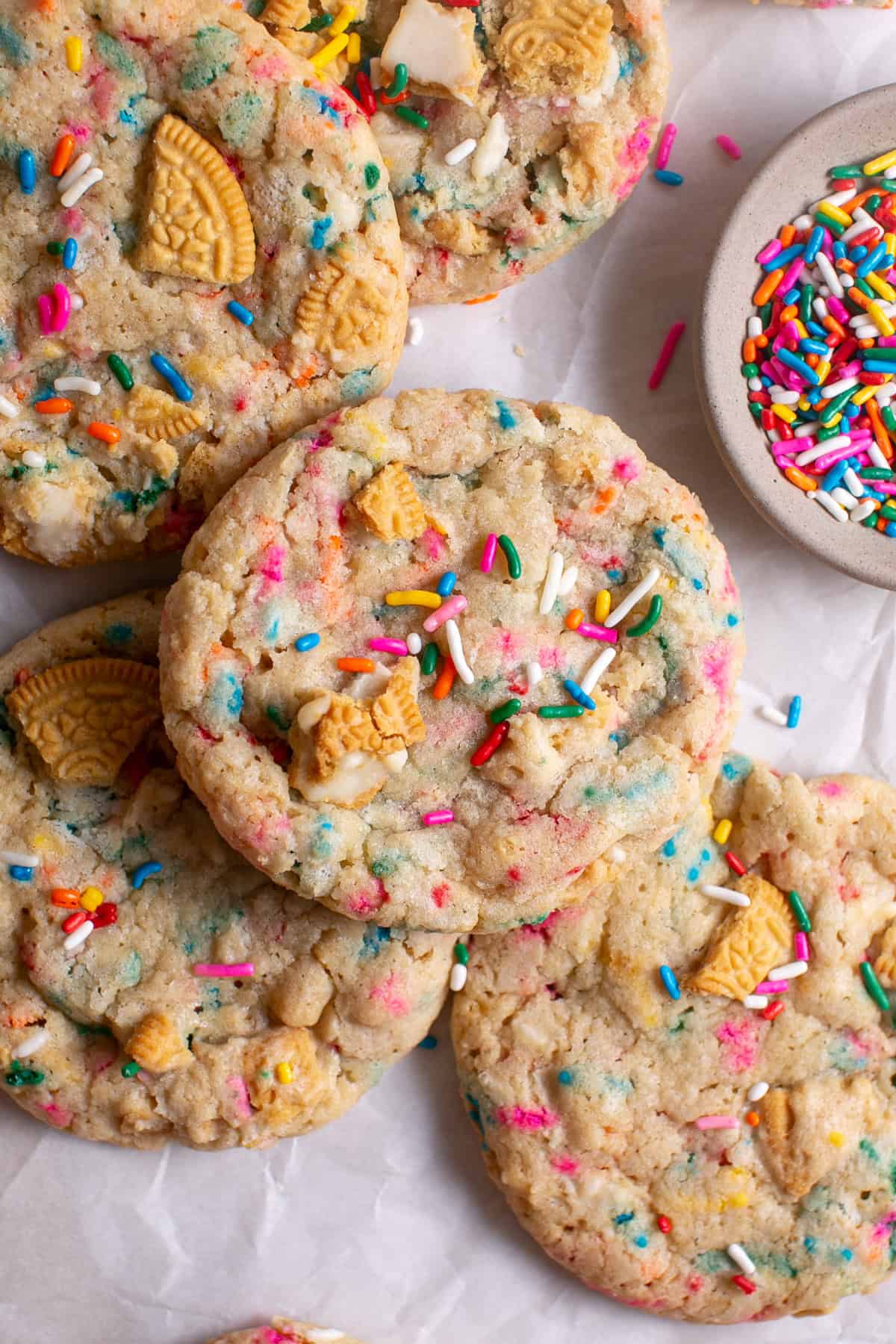 Golden Funfetti Cookies stacked on top of each other.