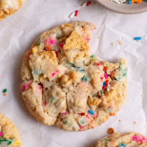 Golden Funfetti Cookies with a bite taken out.