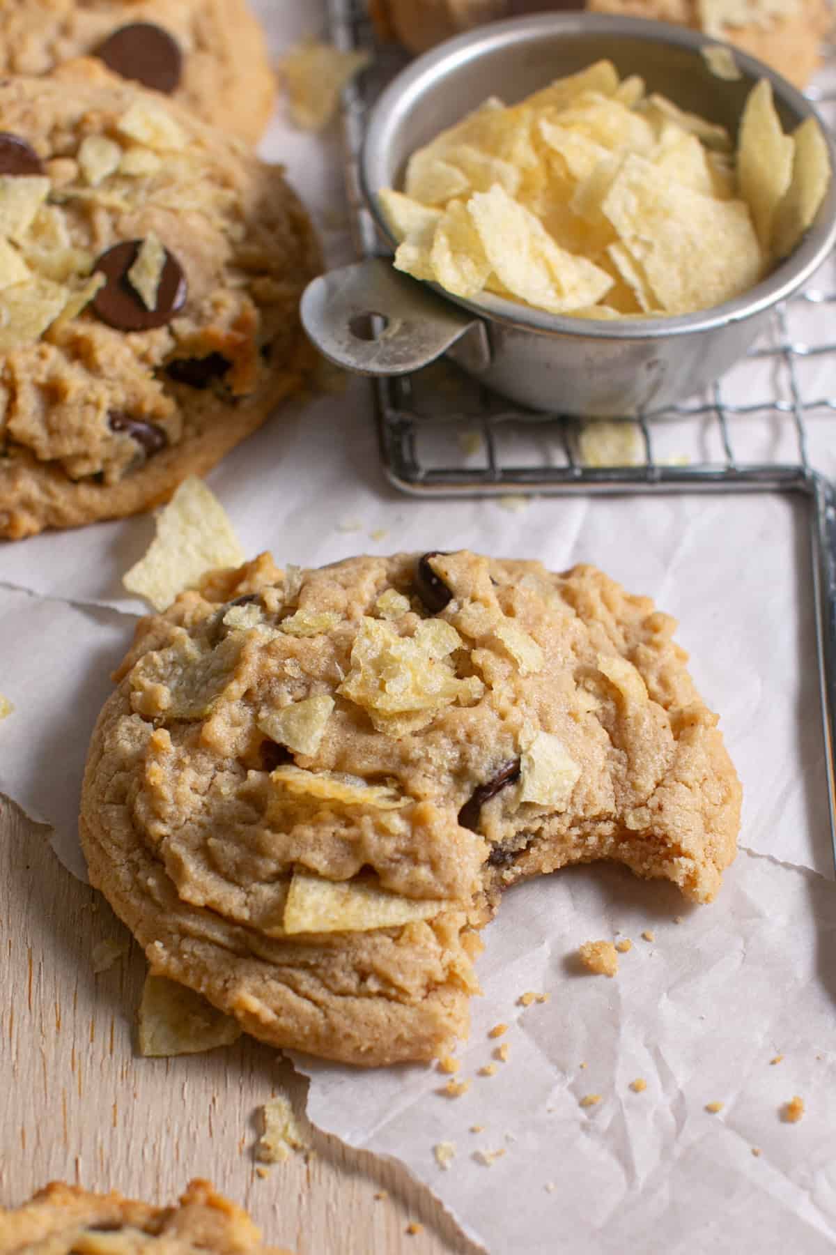 Peanut Butter Potato Chip Cookies with a bite missing. 