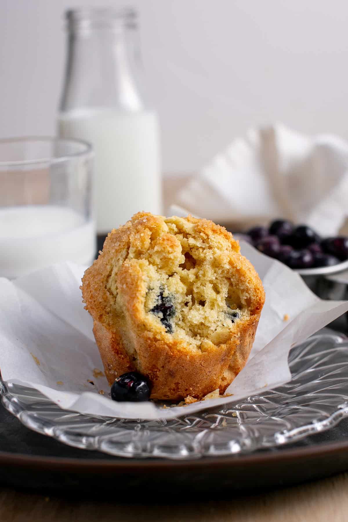 Single Serve Blueberry Muffin with a bite missing. 
