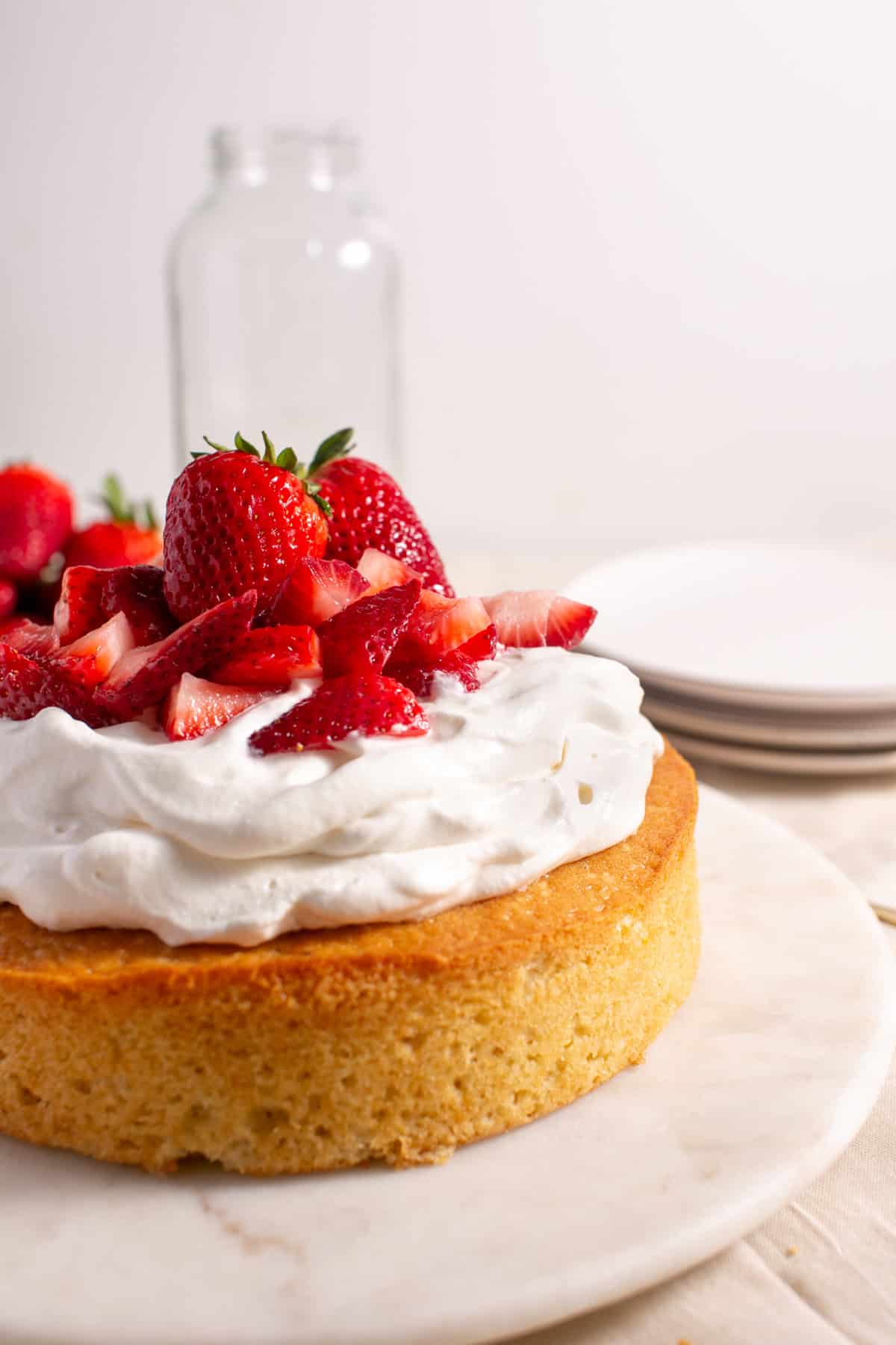 Small Batch Vanilla Cake topped with strawberries. 