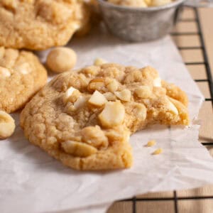 White Chocolate Macadamia Nut Cookies with a bite missing.