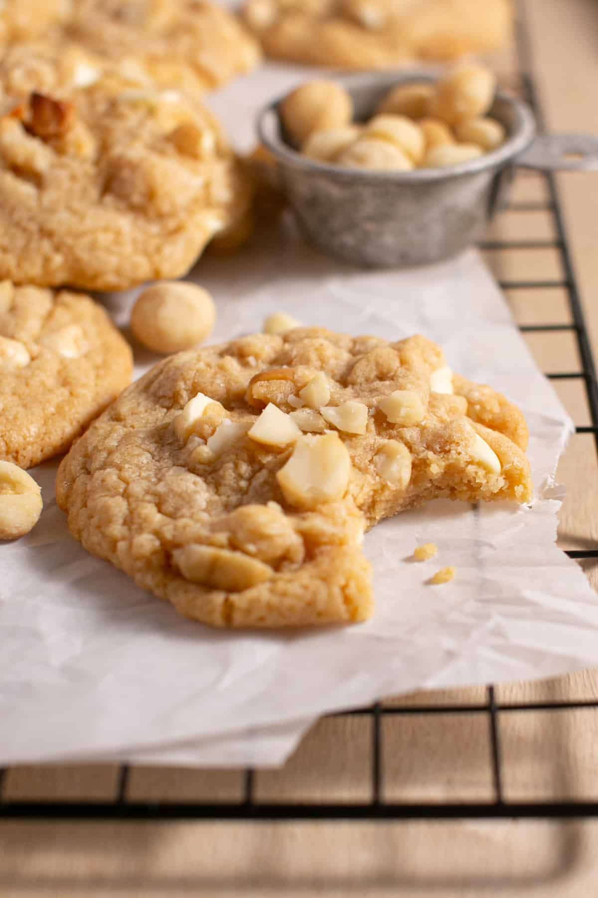 White Chocolate Macadamia Nut Cookies  with a bite taken out. 