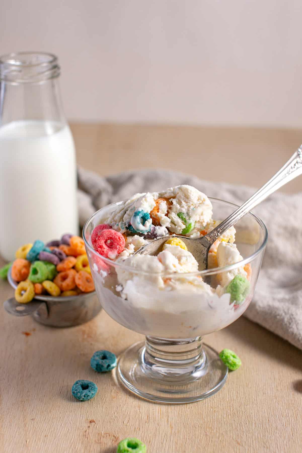 Fruit Loop Ice Cream in a bowl with a spoon. 