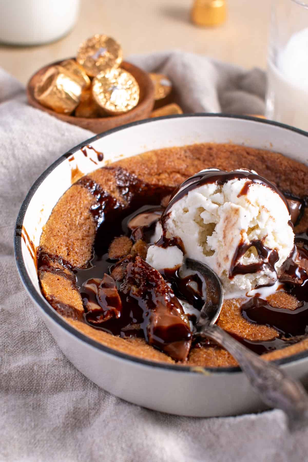Skillet Chocolate Caramel Cookie with a spoon grabbing a bite! 