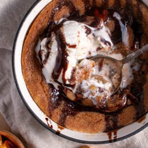 Skillet Chocolate Caramel Cookie with a scoop of ice cream.