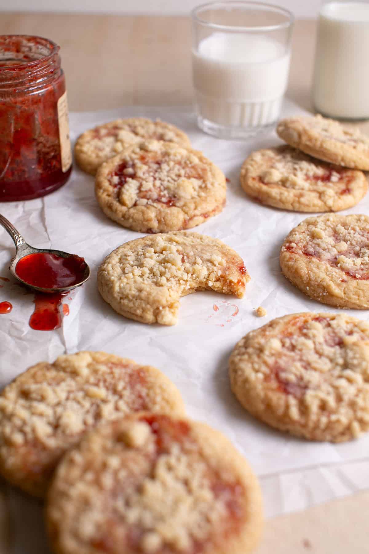 Strawberry Crumble Cookies with a bite missing.