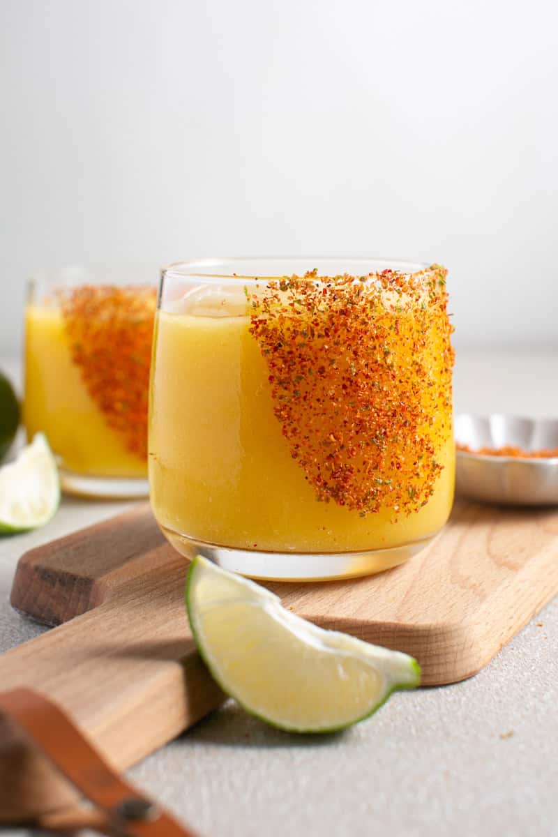 Non-Alcoholic Mango Sorbet Mocktail with limes.