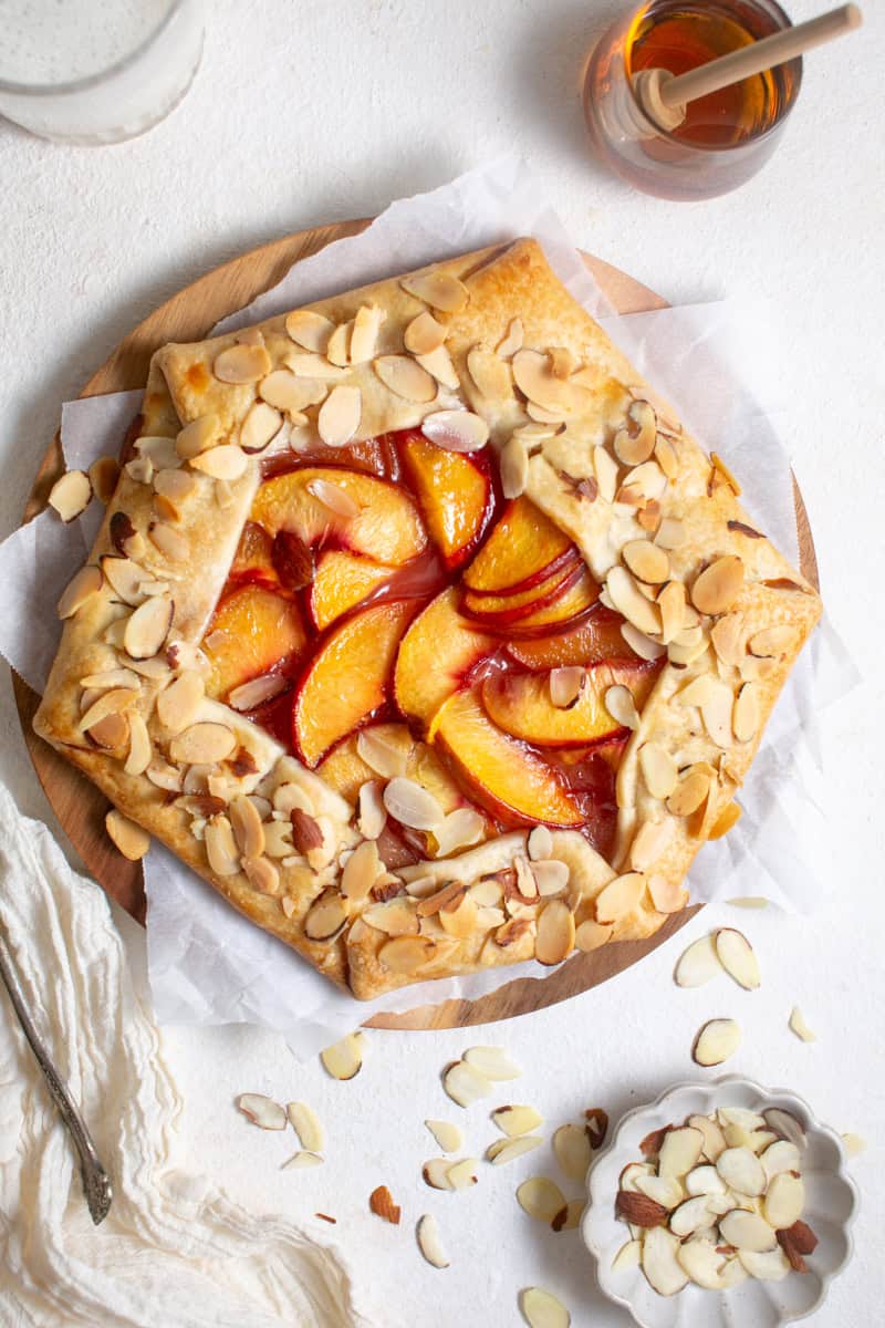 Honey Almond Galette on a wooden stand.