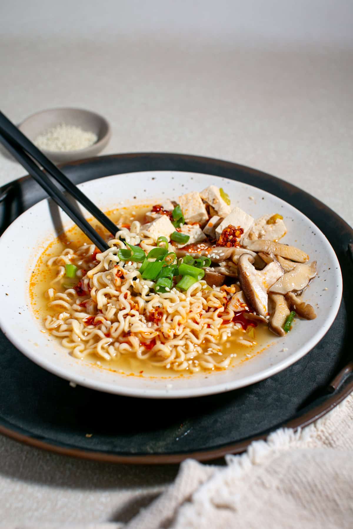 Easy Vegetarian Ramen Recipe with Tofu and Mushroom with chopsticks beside it.