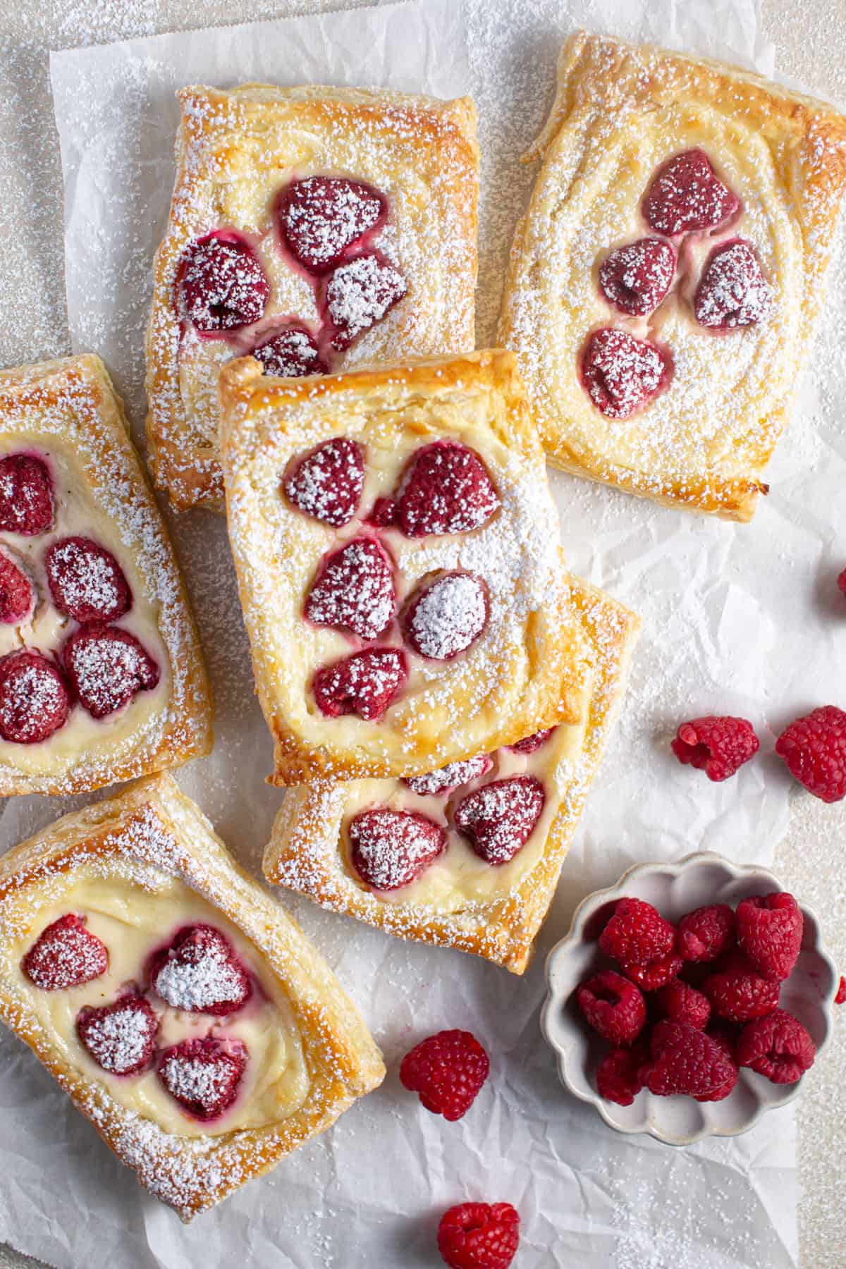 Raspberry Cream Cheese Danish stacked on top of each other.