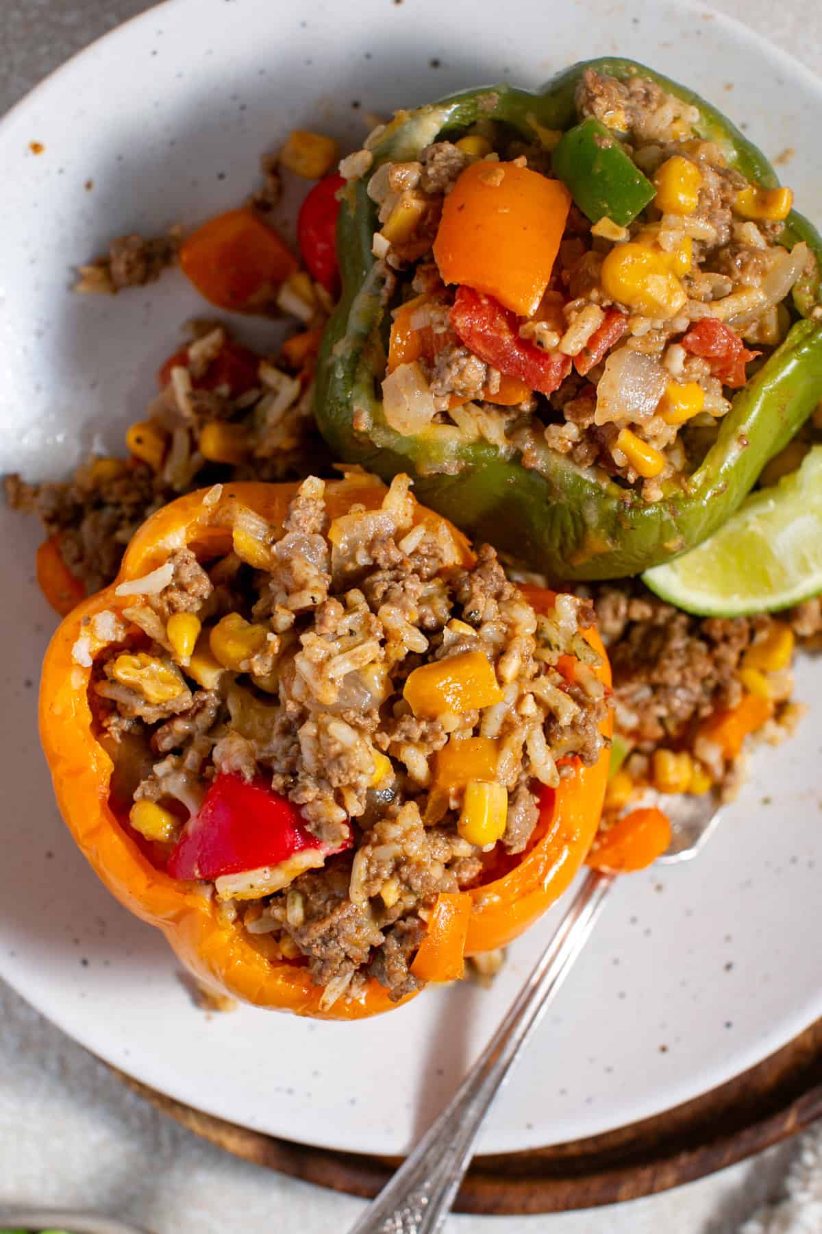 Stuffed Bell Peppers recipe with a lime squeezed over the top. 