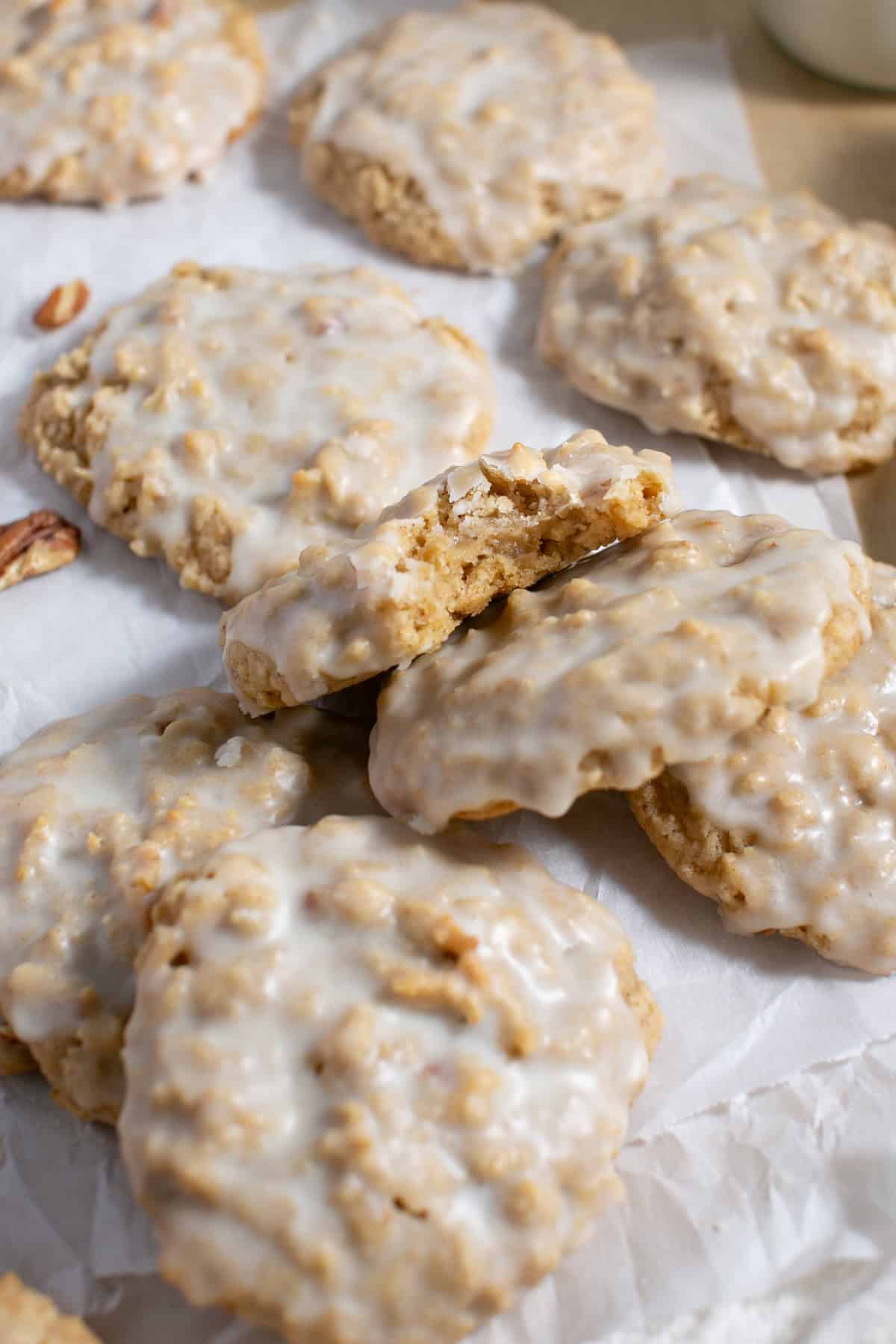 Maple Glazed Oatmeal Cookies on parchment paper. 