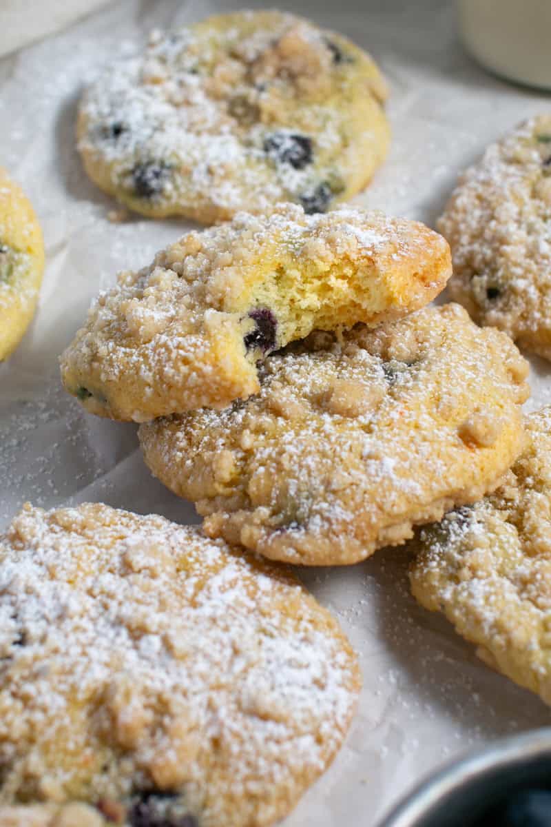 Blueberry Crumble Muffin tops with a bite missing. 