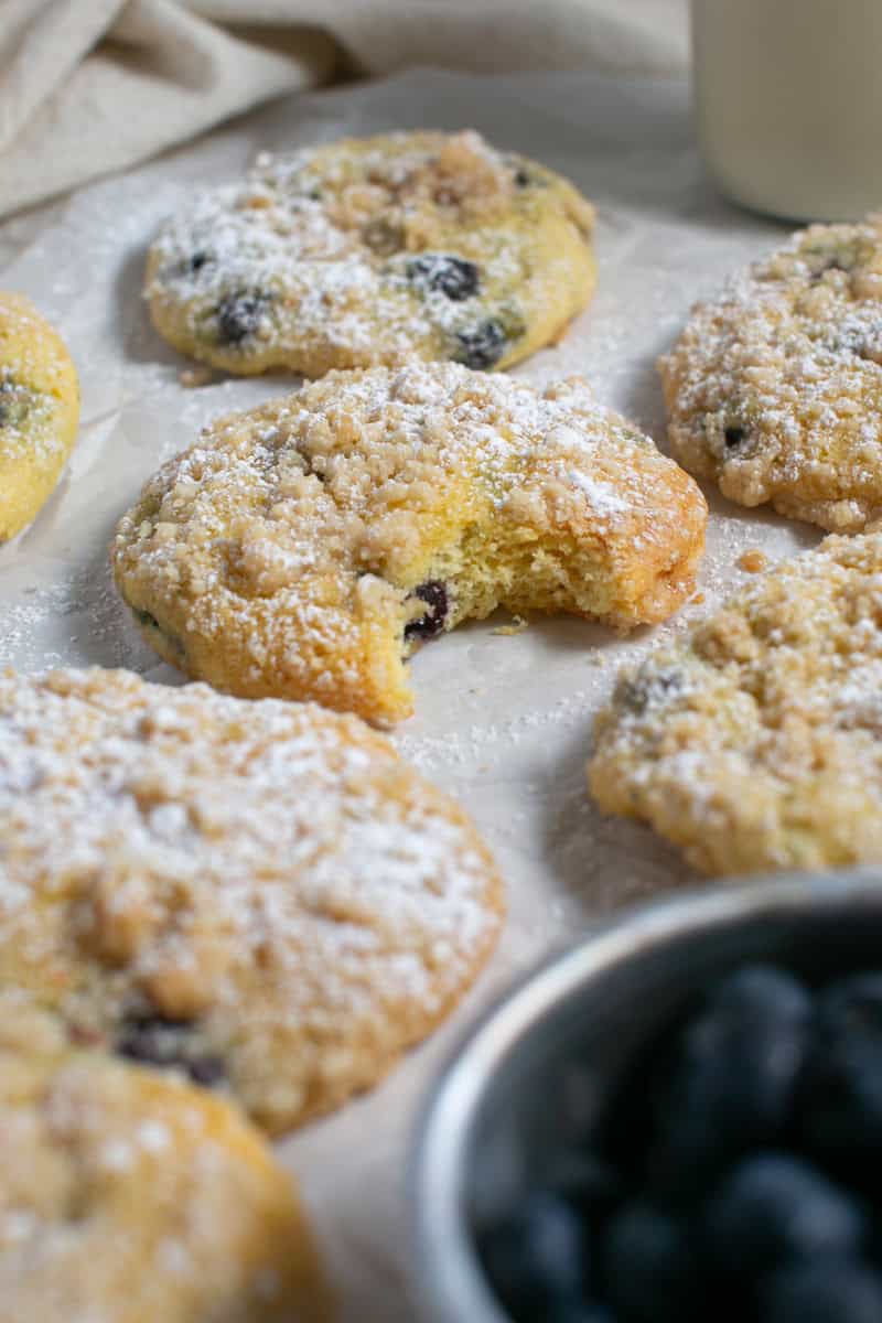 Cake mix blueberry muffin tops with a bite missing. 