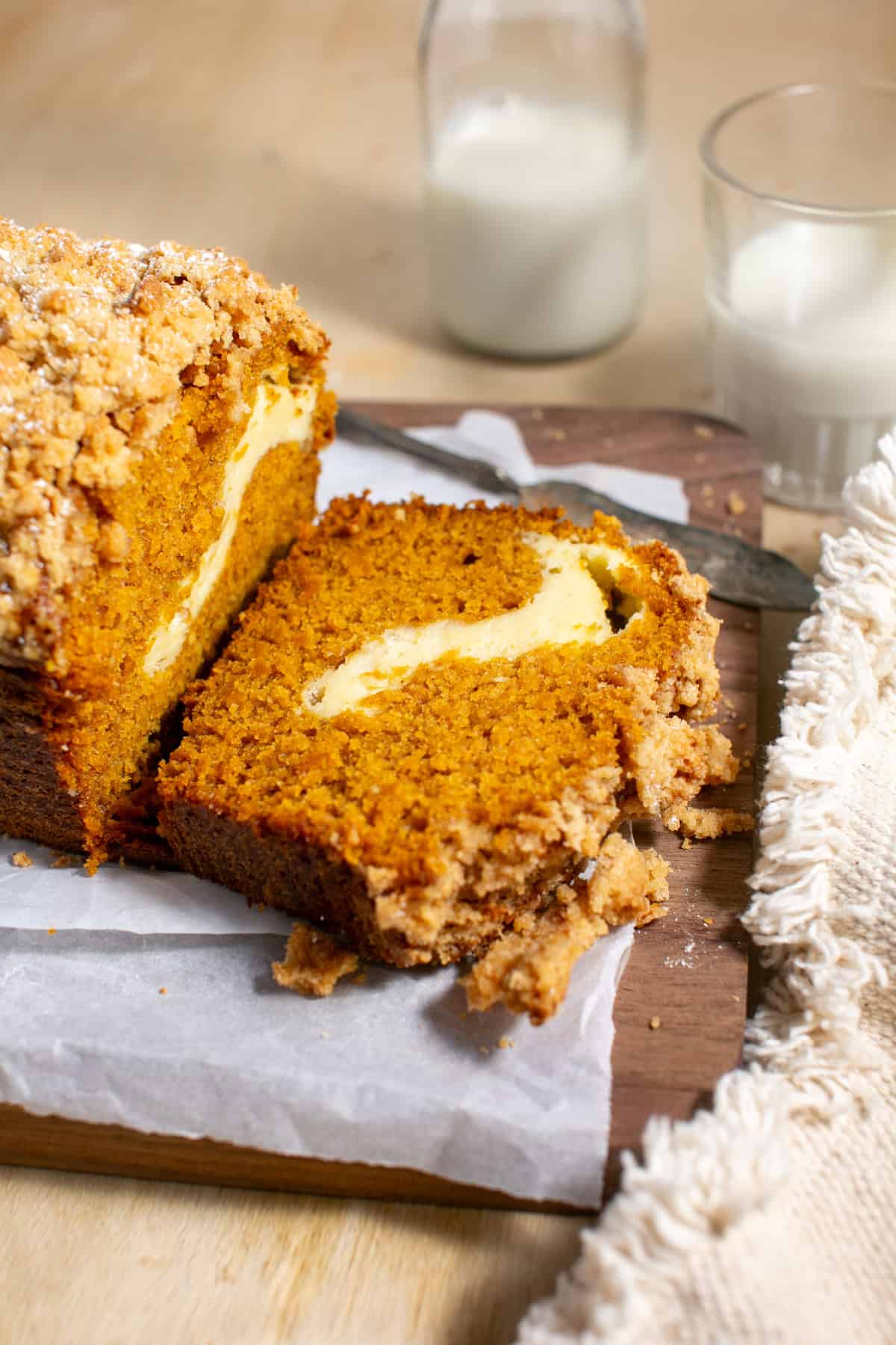 Pumpkin Cheesecake Bread with a glass of milk beside it.