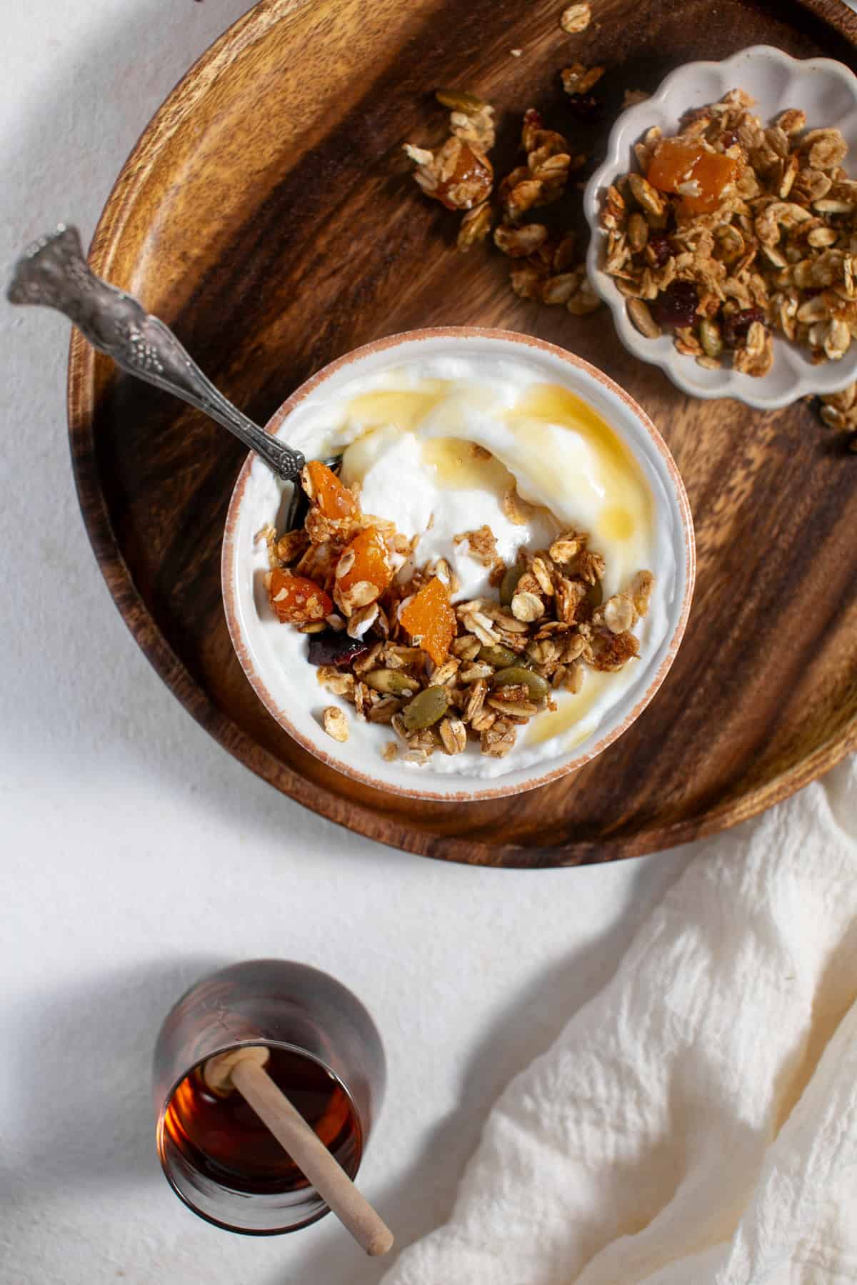 Homemade Pumpkin Spice Granola recipe sprinkled on some yogurt.