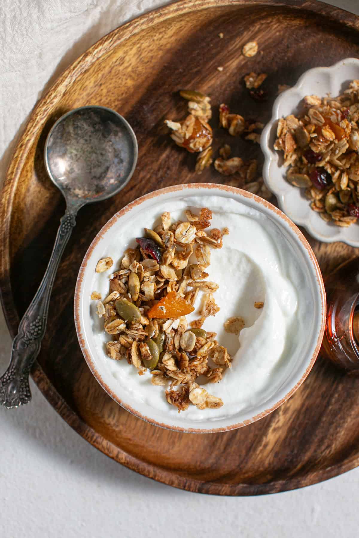 Homemade Pumpkin Spice Granola on a bowl of yogurt. 