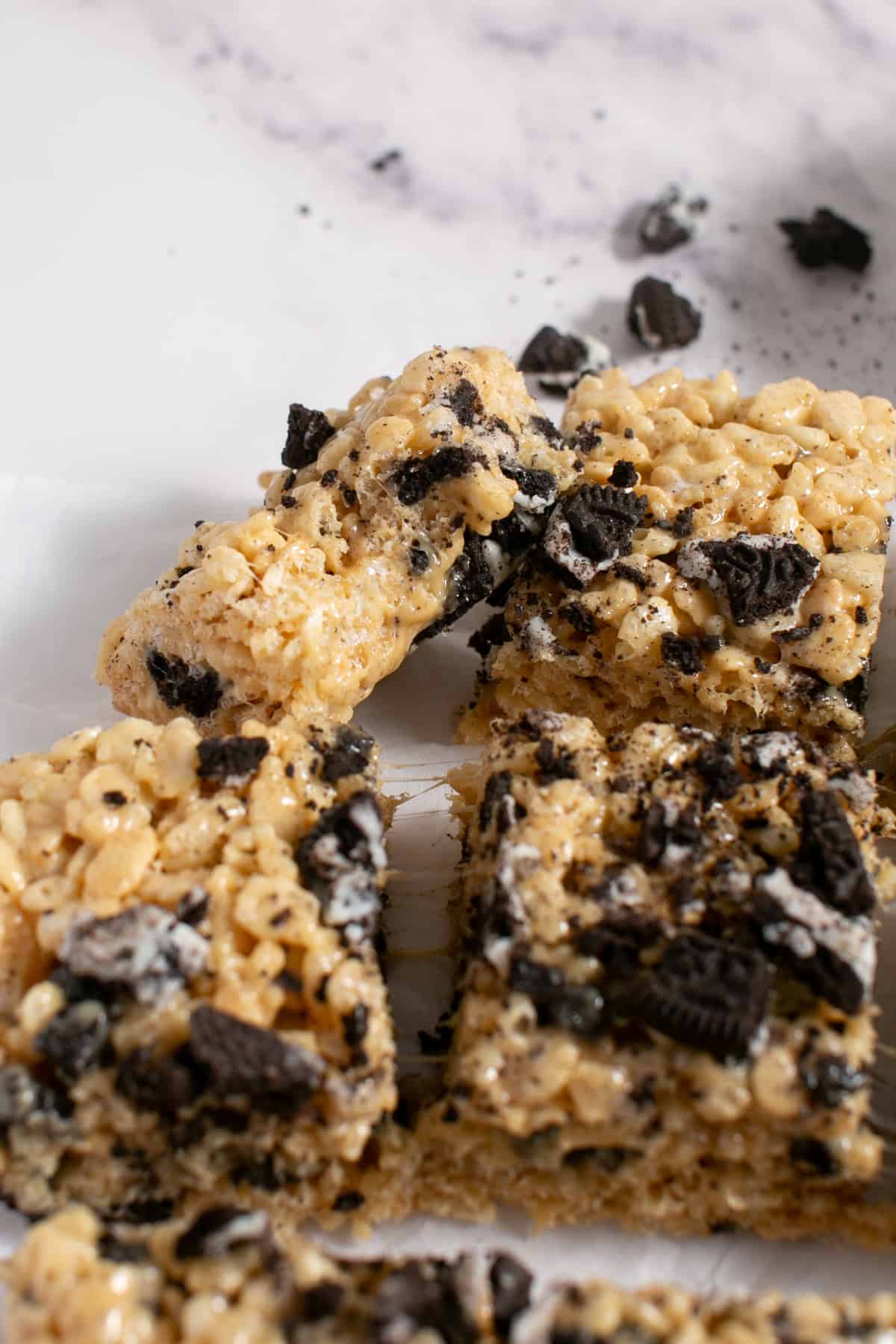 Peanut Butter Oreo Rice Krispie Treats stacked on each other.