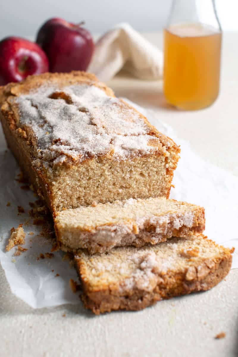 Apple Cider loaf being cut into slices.